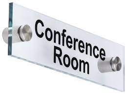 metal standoff sign that says conference room